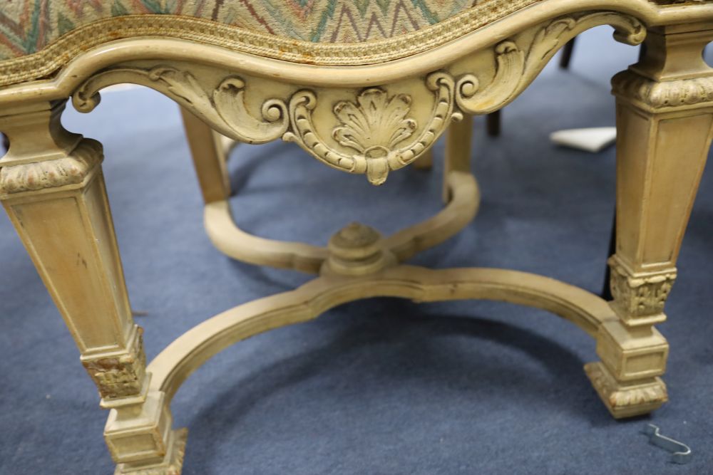 A set of four caned high back dining chairs